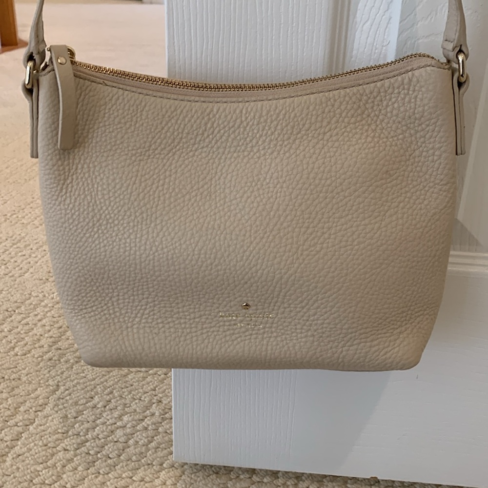 Kate Spade Cream Pebbled Leather Cross Body with Pink Lining. Good Condition.